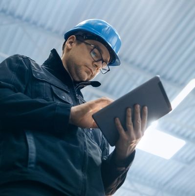 Technician inspecting a fire protection system gauge